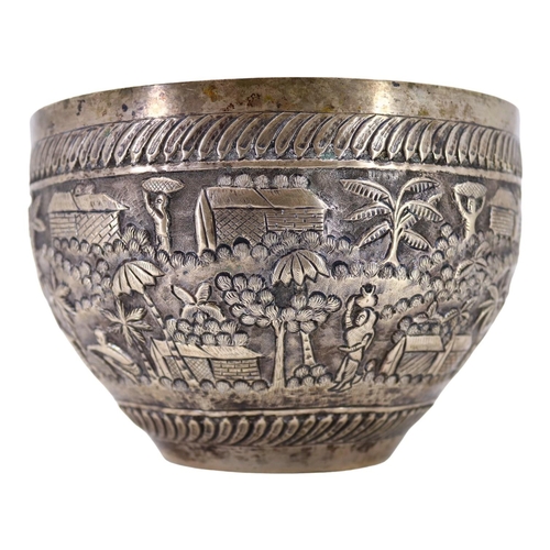 64 - PROBABLY CALCUTTA, INDIA. LATE 19TH/EARLY 20TH CENTURY INDIAN SILVER BOWL. Decorated with village la... 