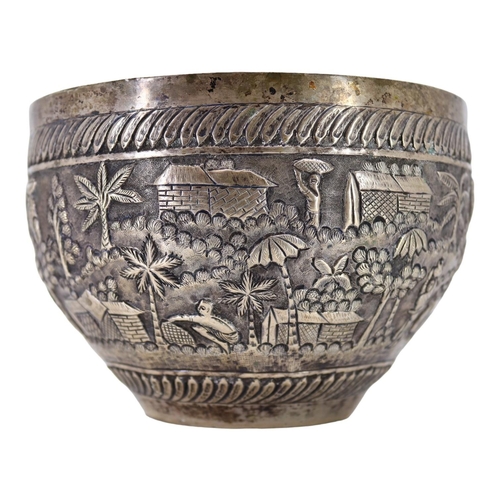 64 - PROBABLY CALCUTTA, INDIA. LATE 19TH/EARLY 20TH CENTURY INDIAN SILVER BOWL. Decorated with village la... 