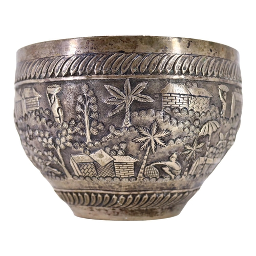 64 - PROBABLY CALCUTTA, INDIA. LATE 19TH/EARLY 20TH CENTURY INDIAN SILVER BOWL. Decorated with village la... 