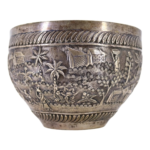 64 - PROBABLY CALCUTTA, INDIA. LATE 19TH/EARLY 20TH CENTURY INDIAN SILVER BOWL. Decorated with village la... 