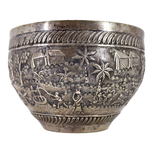 64 - PROBABLY CALCUTTA, INDIA. LATE 19TH/EARLY 20TH CENTURY INDIAN SILVER BOWL. Decorated with village la... 