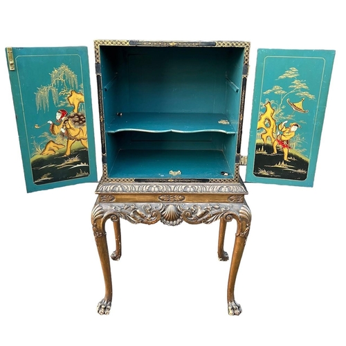 216 - AN EARLY 20TH CENTURY GEORGE II DESIGN JAPANNED LACQUERED CHINOISERIE DECORATED CABINET ON STANDThe ... 