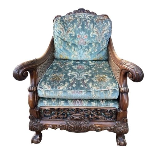 223 - A GOOD LATE 19TH/EARLY 20TH CENTURY CARVED MAHOGANY BERGERE SUITEComprising a double caned three sea... 