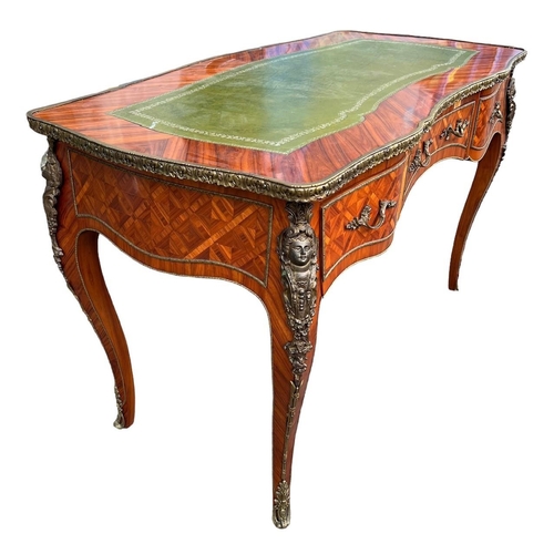 226 - A LOUIS XV DESIGN GILT METAL MOUNTED KINGWOOD WRITING TABLEThe green tooled leather top above three ... 