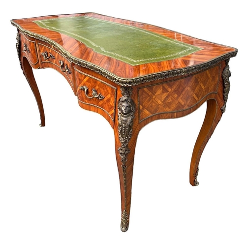 226 - A LOUIS XV DESIGN GILT METAL MOUNTED KINGWOOD WRITING TABLEThe green tooled leather top above three ... 