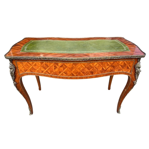 226 - A LOUIS XV DESIGN GILT METAL MOUNTED KINGWOOD WRITING TABLEThe green tooled leather top above three ... 