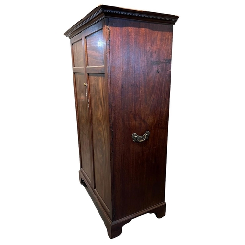 232 - A GEORGE III MAHOGANY TWO DOOR WARDROBEThe doors opening to reveal hanging rail the side fitted with... 