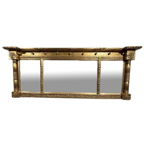 239 - A REGENCY GILTWOOD TRIPLE PLATE OVER MANTLE MIRRORDecorated with scrolling foliage and shells.(h 67c... 