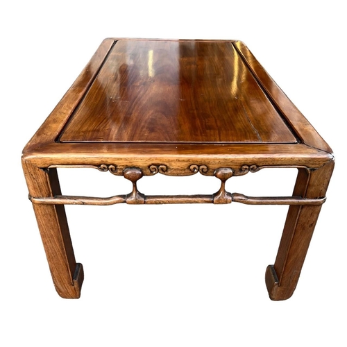 256 - AN 18TH/19TH CENTURY CHINESE HUANGHUALI LOW TABLE The single rectangular inserted panel top above ca... 