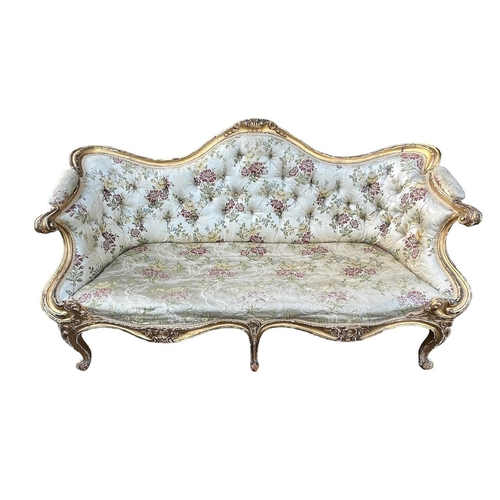 270 - MANNER OF THOMAS CHIPPENDALE, A GEORGE III CARVED GILTWOOD SETTEE
The shaped back decorated with cen... 