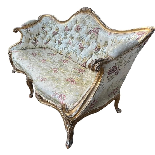 270 - MANNER OF THOMAS CHIPPENDALE, A GEORGE III CARVED GILTWOOD SETTEE
The shaped back decorated with cen... 