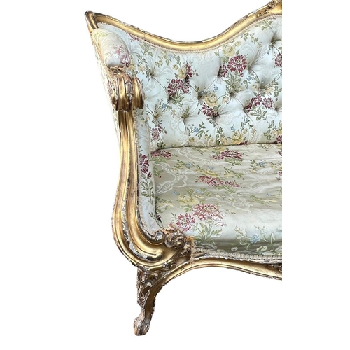 270 - MANNER OF THOMAS CHIPPENDALE, A GEORGE III CARVED GILTWOOD SETTEE
The shaped back decorated with cen... 