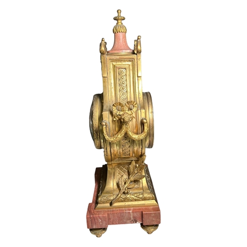 274A - A 19TH CENTURY FRENCH MARBLE AND GILT ORMOLU MANTEL CLOCK
Decorated with finely cast scroll and bow ... 