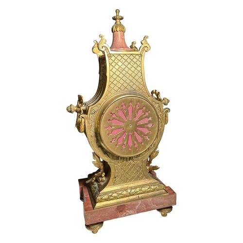 274A - A 19TH CENTURY FRENCH MARBLE AND GILT ORMOLU MANTEL CLOCK
Decorated with finely cast scroll and bow ... 