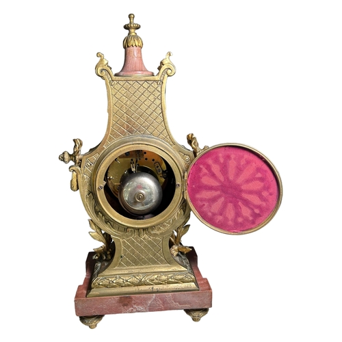 274A - A 19TH CENTURY FRENCH MARBLE AND GILT ORMOLU MANTEL CLOCK
Decorated with finely cast scroll and bow ... 