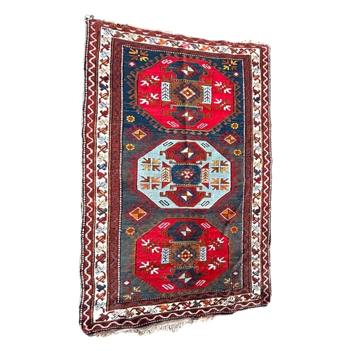 252 - LORI PAMBAK KAZAK RUGHaving blue field with central light blue and red octagonal medallion flanked b... 