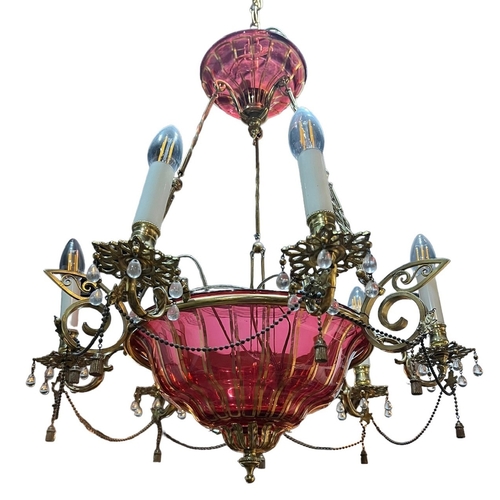 263 - A 19TH CENTURY CRANBERRY GLASS AND GILT METAL CHANDELIER 
With six scrolls arms with glass droplets ... 