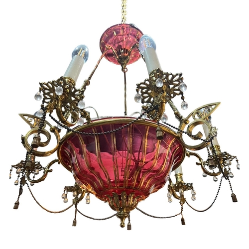 263 - A 19TH CENTURY CRANBERRY GLASS AND GILT METAL CHANDELIER 
With six scrolls arms with glass droplets ... 