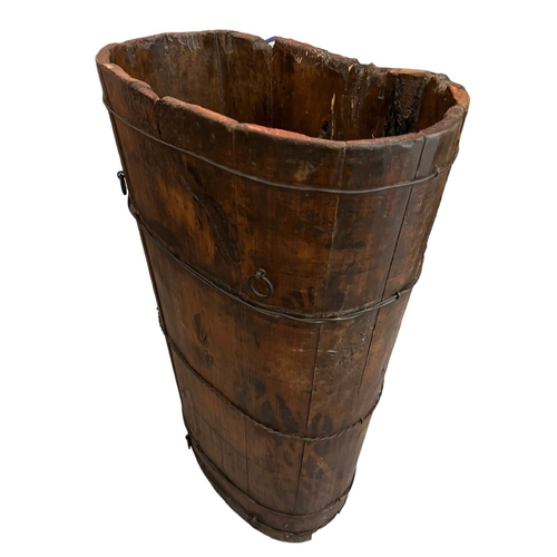 262 - A 19TH CENTURY PINE AND METAL GRAPE HARVEST HOD BARREL.
(h 76cm x d 28cm x w 48cm)