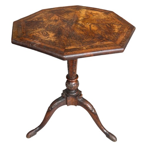 268 - A GEORGE II CARVED WALNUT TRIPOD TABLE
The octagonal top inlaid with burr wood supported on a carved... 