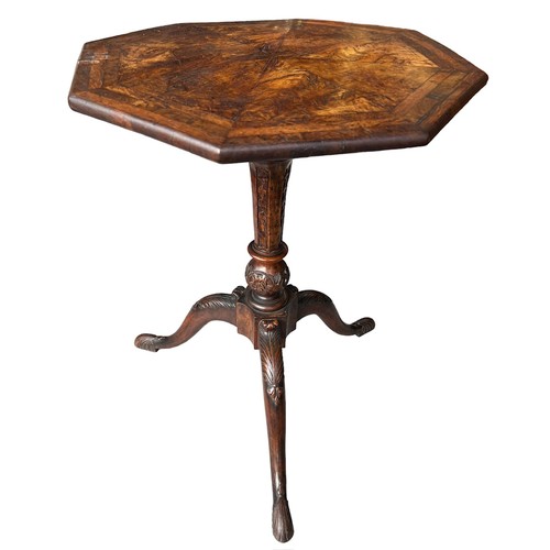 268 - A GEORGE II CARVED WALNUT TRIPOD TABLE
The octagonal top inlaid with burr wood supported on a carved... 