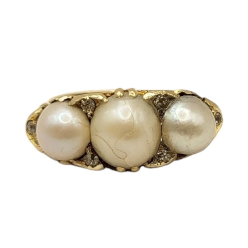 14 - A VICTORIAN YELLOW METAL, THREE PEARL AND DIAMOND RING (YELLOW METAL TESTS AS 14CT)
Central pearl (a... 