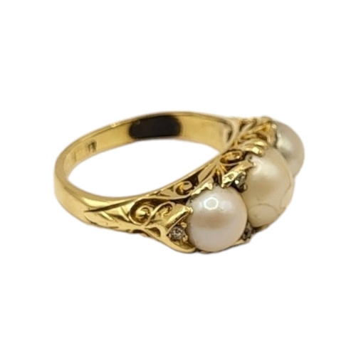 14 - A VICTORIAN YELLOW METAL, THREE PEARL AND DIAMOND RING (YELLOW METAL TESTS AS 14CT)
Central pearl (a... 