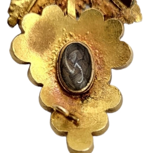 15 - A VICTORIAN ETRUSCAN REVIVAL YELLOW METAL AND CABOCHON GARNET MEMENTO MORI BROOCH FORMED AS GRAPES, ... 