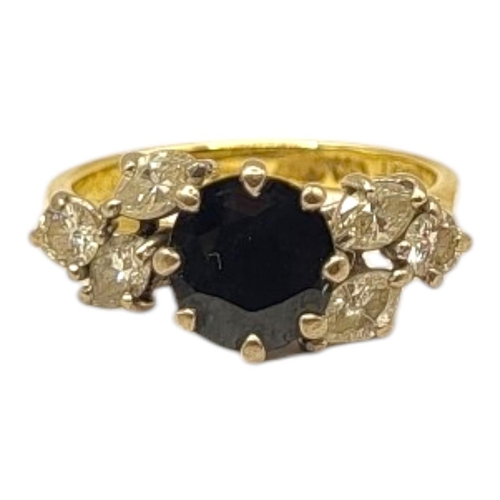 18 - AN 18CT YELLOW AND WHITE GOLD, SAPPHIRE AND DIAMOND RING
The central round cut sapphire (approx diam... 