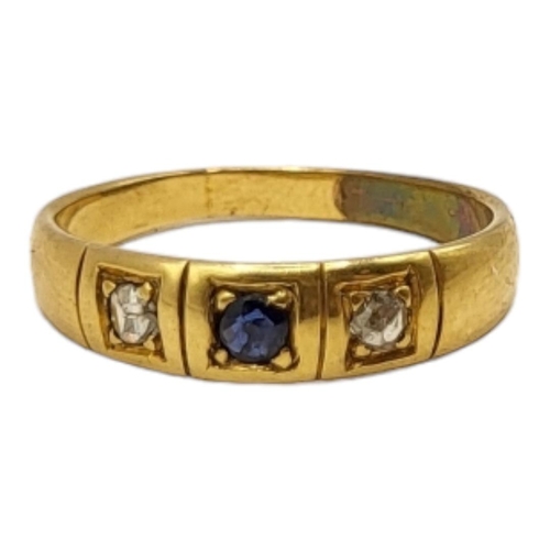 27 - A 20TH CENTURY YELLOW METAL, BLUE TOPAZ AND DIAMOND GYPSY SET RING (YELLOW METAL TESTED AS 14CT GOLD... 