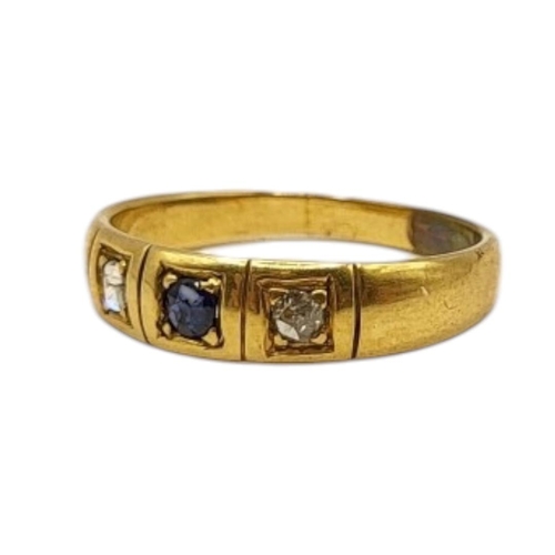 27 - A 20TH CENTURY YELLOW METAL, BLUE TOPAZ AND DIAMOND GYPSY SET RING (YELLOW METAL TESTED AS 14CT GOLD... 