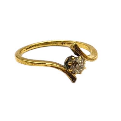 29 - AN EDWARDIAN 18CT GOLD AND DIAMOND SOLITAIRE CROSSOVER RING
The old European cut diamond (approx. 4m... 