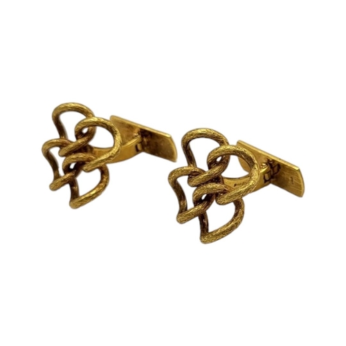 31 - A VINTAGE PAIR OF 18CT GOLD DESIGNER STYLE CUFFLINKS
Having stylised textured finish. 
(24mm x 24mm,... 