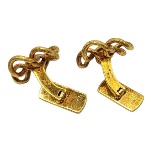 31 - A VINTAGE PAIR OF 18CT GOLD DESIGNER STYLE CUFFLINKS
Having stylised textured finish. 
(24mm x 24mm,... 