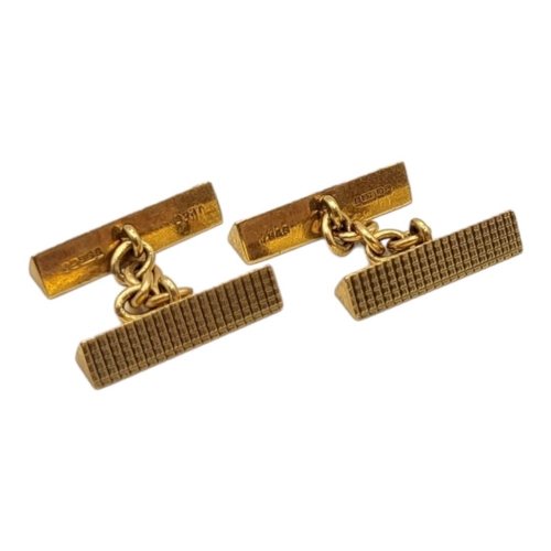 34 - A 20TH CENTURY PAIR OF 9CT GOLD TRIANGULAR PRISM CUFFLINKS
Textured finish. 
(19mm x 5mm, 10.4g)