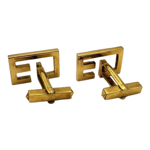 35 - A VINTAGE PAIR OF YELLOW METAL MONOGRAMMED CUFFLINKS (YELLOW METAL TESTS AS 9CT)
Having textured fin... 