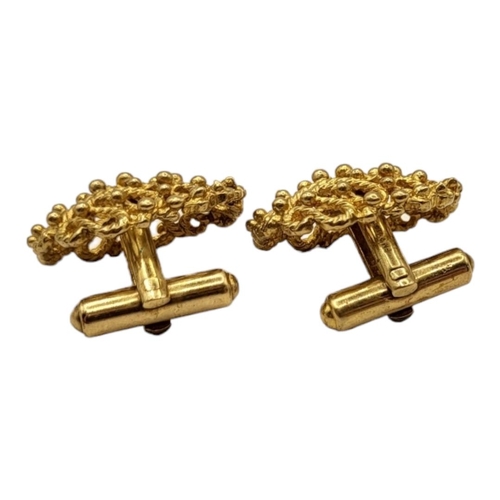 37 - A VINTAGE PAIR OF 9CT GOLD CUFFLINKS
Having stylised rope and bead decoration.
(25mm x 21mm, 14g)