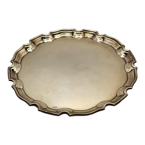 59 - ADIE BROTHERS LTD, A SILVER SALVER CARD TRAY
Hallmarked Birmingham, 1938, round Chippendale style bo... 