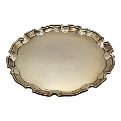 59 - ADIE BROTHERS LTD, A SILVER SALVER CARD TRAY
Hallmarked Birmingham, 1938, round Chippendale style bo... 