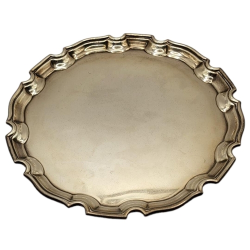 59 - ADIE BROTHERS LTD, A SILVER SALVER CARD TRAY
Hallmarked Birmingham, 1938, round Chippendale style bo... 