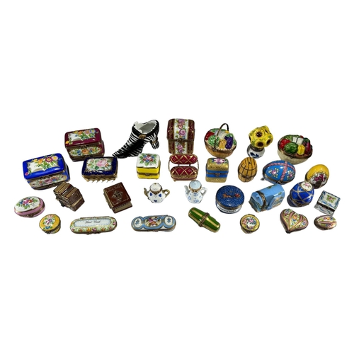 136 - LIMOGES, FRANCE, A COLLECTION OF THIRTY ‘PEINT MAIN’ TRINKET BOXES, TO INCLUDE NOVELTY EXAMPLES
Comp... 