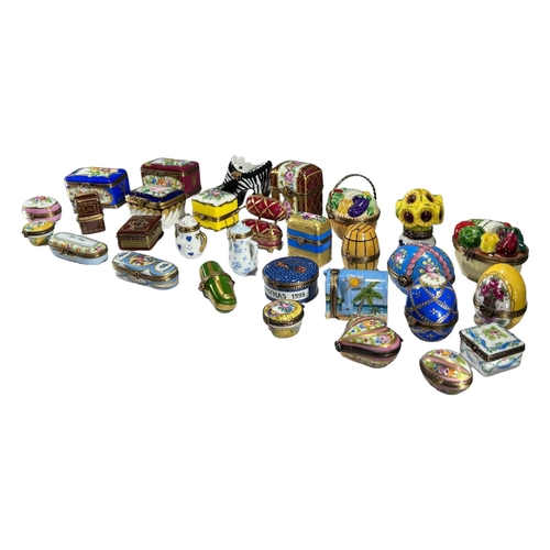 136 - LIMOGES, FRANCE, A COLLECTION OF THIRTY ‘PEINT MAIN’ TRINKET BOXES, TO INCLUDE NOVELTY EXAMPLES
Comp... 