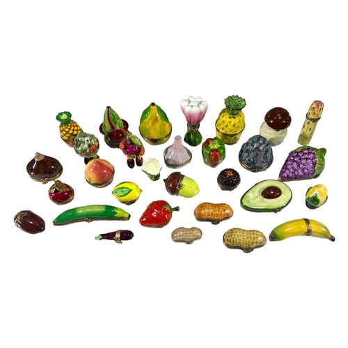 146 - LIMOGES, FRANCE, A COLLECTION OF THIRTY ‘PEINT MAIN’ FRUIT & VEGETABLE THEMED TRINKET BOXES
Comprisi... 