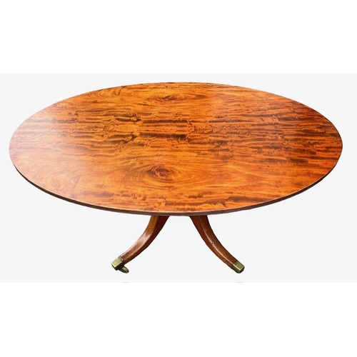 204 - A 19TH CENTURY FLAME MAHOGANY OVAL TILT TOP BREAKFAST TABLE
Supported on a turned pedestal base, ter... 