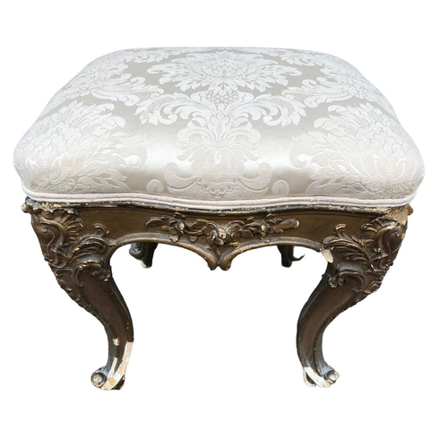 212 - GILLOWS, A 19TH CENTURY CARVED WALNUT CIRCULAR FOOTSTOOL
The upholstered top, raised on four cabriol... 