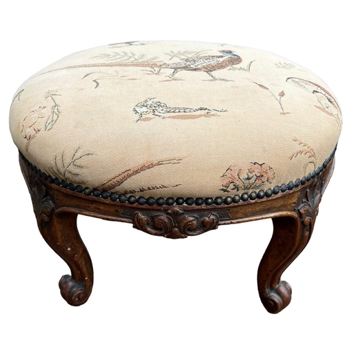 212 - GILLOWS, A 19TH CENTURY CARVED WALNUT CIRCULAR FOOTSTOOL
The upholstered top, raised on four cabriol... 