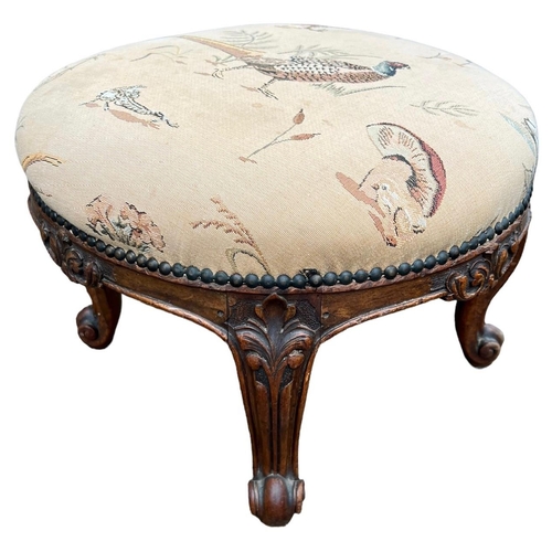 212 - GILLOWS, A 19TH CENTURY CARVED WALNUT CIRCULAR FOOTSTOOL
The upholstered top, raised on four cabriol... 