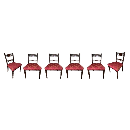 224 - A SET OF SIX 19TH CENTURY REGENCY MAHOGANY AND INLAID BAR BACK DINING CHAIRS
With upholstered seats,... 