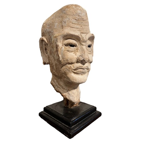 200 - A CHINESE MING PERIOD TERRACOTTA 
Polychrome painted head of a Luohan with polished stone inset eyes... 