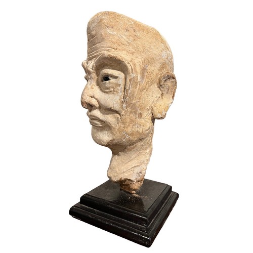 200 - A CHINESE MING PERIOD TERRACOTTA 
Polychrome painted head of a Luohan with polished stone inset eyes... 